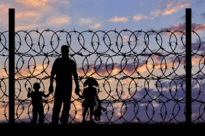 Silhouette of a family with children refugees